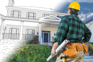 Construction worker in a yellow hard hat and tool belt examining a house, half rendered as architectural blueprint and half as a completed home, representing residential building design and renovation planning.